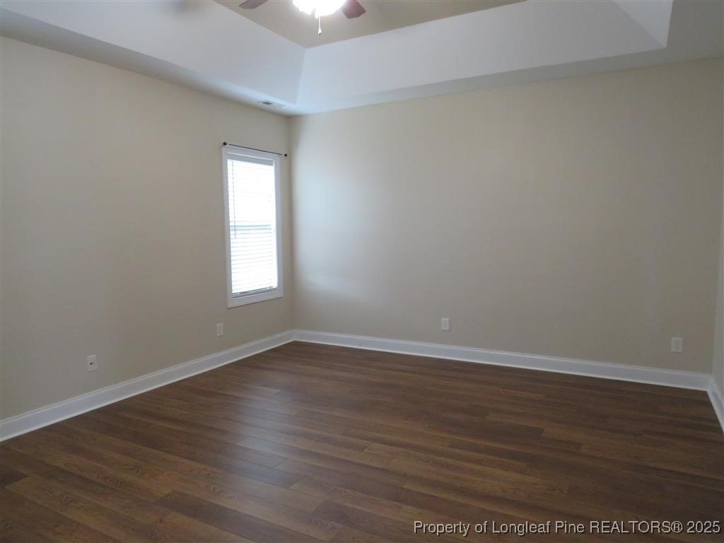 19 Turner Matthew Court Spring Lake, NC 28390 - Photo 15 of 20 a view of an empty room with wooden floor and a window