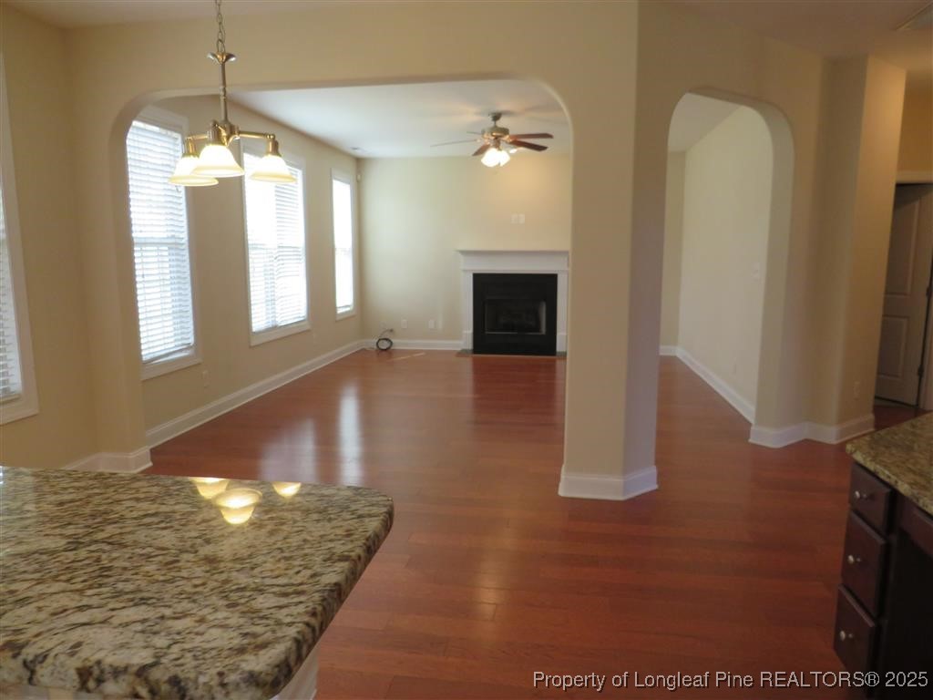 19 Turner Matthew Court Spring Lake, NC 28390 - Photo 3 of 20 a view of a livingroom with wooden floor and a fireplace