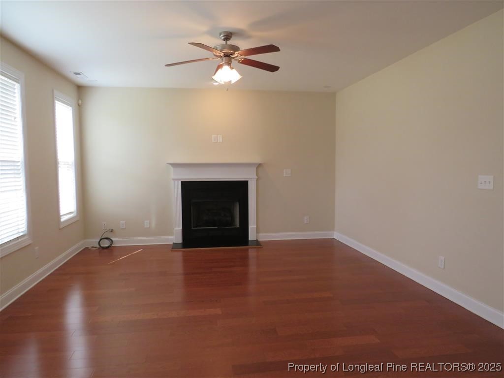 19 Turner Matthew Court Spring Lake, NC 28390 - Photo 4 of 20 an empty room with windows and fireplace
