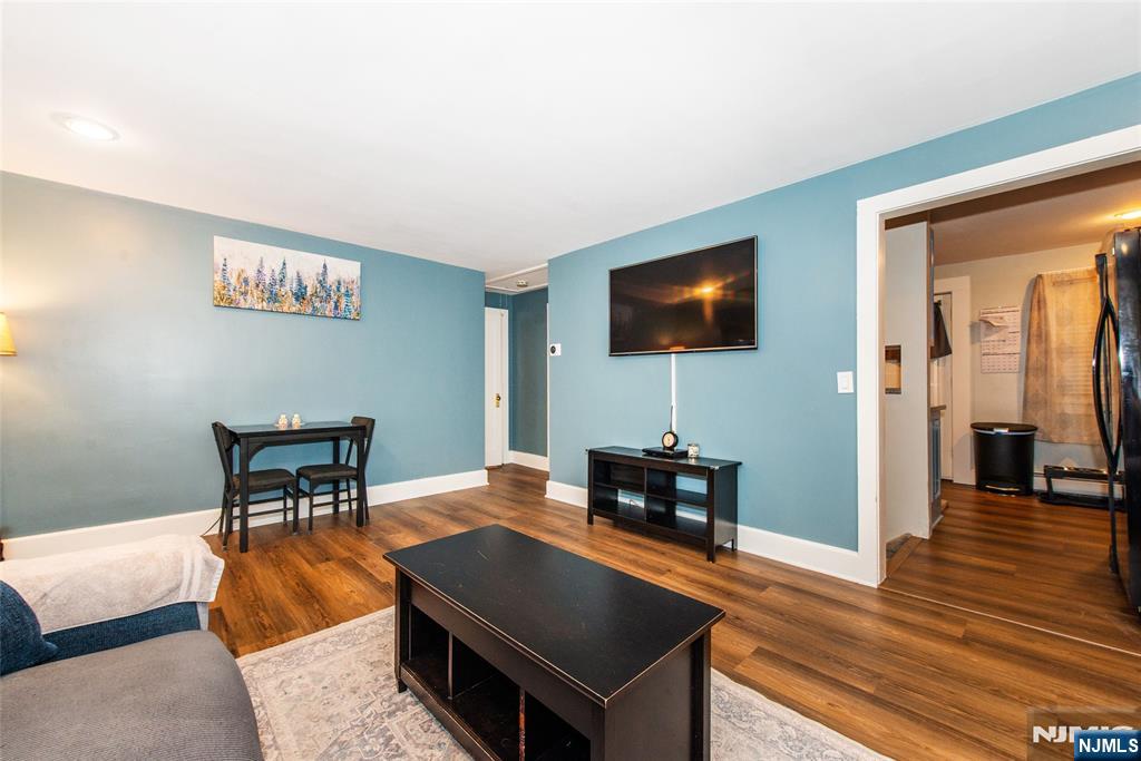 304 Squaw Trail Hopatcong, NJ 07821 - Photo 4 of 20 a living room with furniture and a flat screen tv