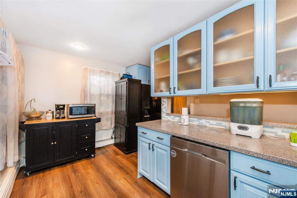 304 Squaw Trail Hopatcong, NJ 07821 - Photo 6 of 20 a kitchen with granite countertop a refrigerator and a sink