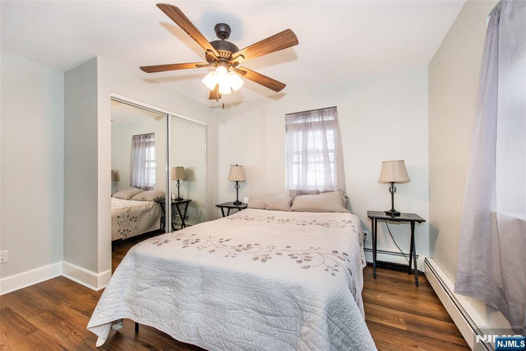 304 Squaw Trail Hopatcong, NJ 07821 - Photo 10 of 20 a bedroom with a bed and a chandelier