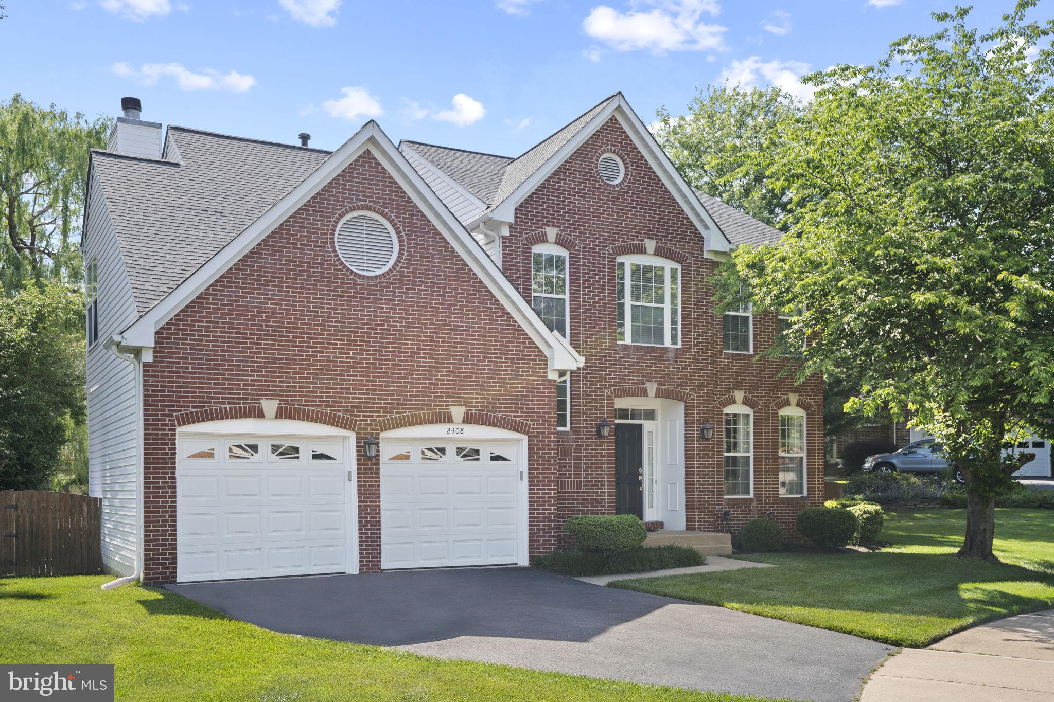 2408 Ripplemeade Court Herndon, VA 20171 - Photo 1 of 36 a front view of a house with a yard