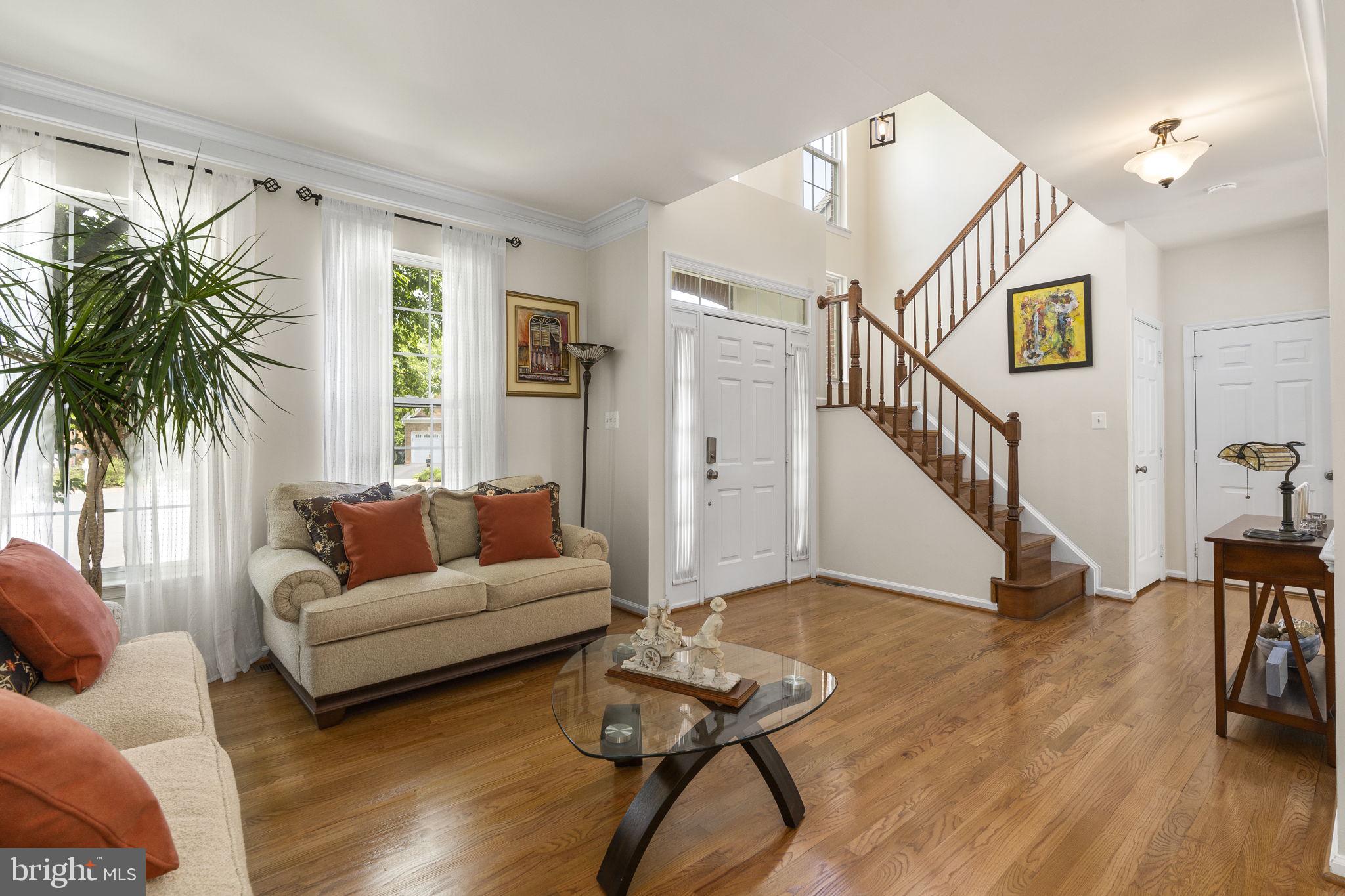 2408 Ripplemeade Court Herndon, VA 20171 - Photo 11 of 36 a living room with furniture and a wooden floor
