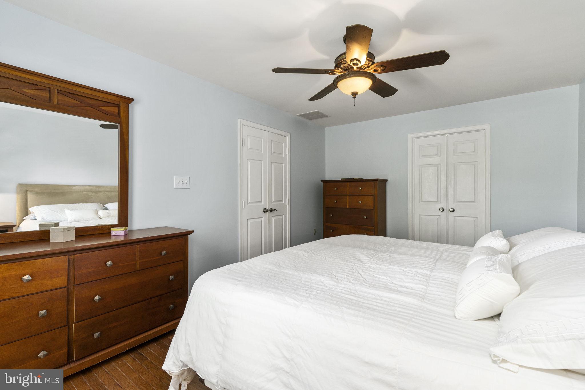 2408 Ripplemeade Court Herndon, VA 20171 - Photo 18 of 36 a bedroom with a bed and a dresser
