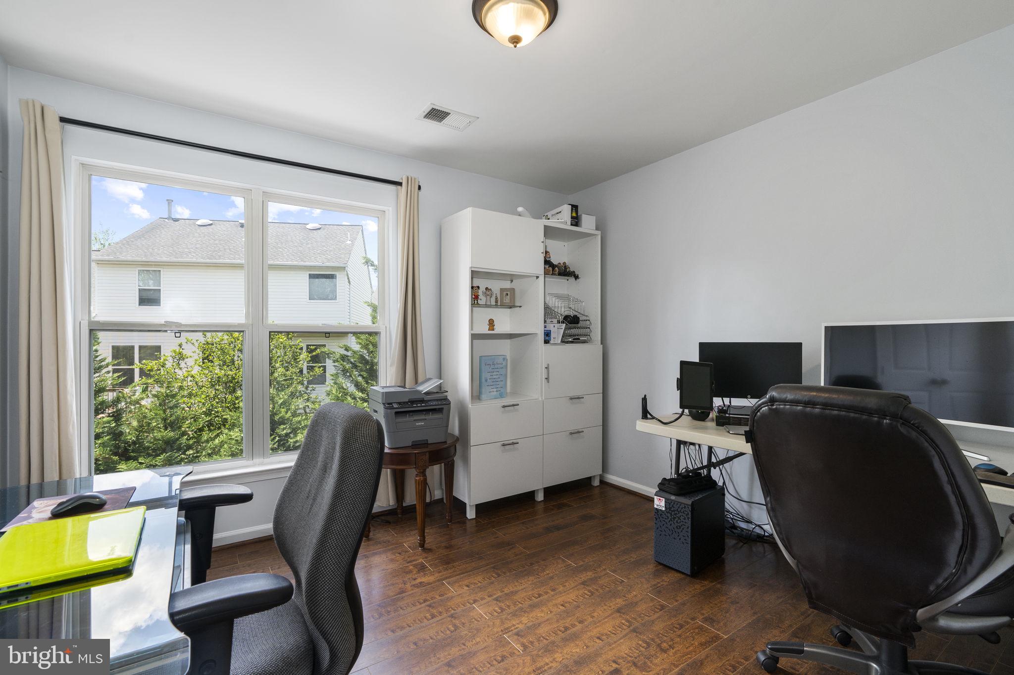 2408 Ripplemeade Court Herndon, VA 20171 - Photo 22 of 36 a view of a workspace with furniture and a window