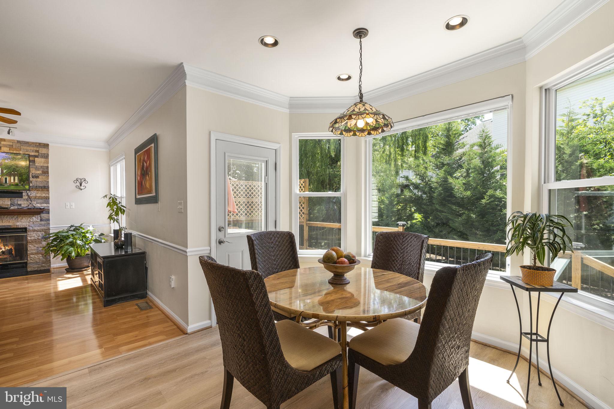 2408 Ripplemeade Court Herndon, VA 20171 - Photo 4 of 36 a view of a dining room with furniture window and wooden floor