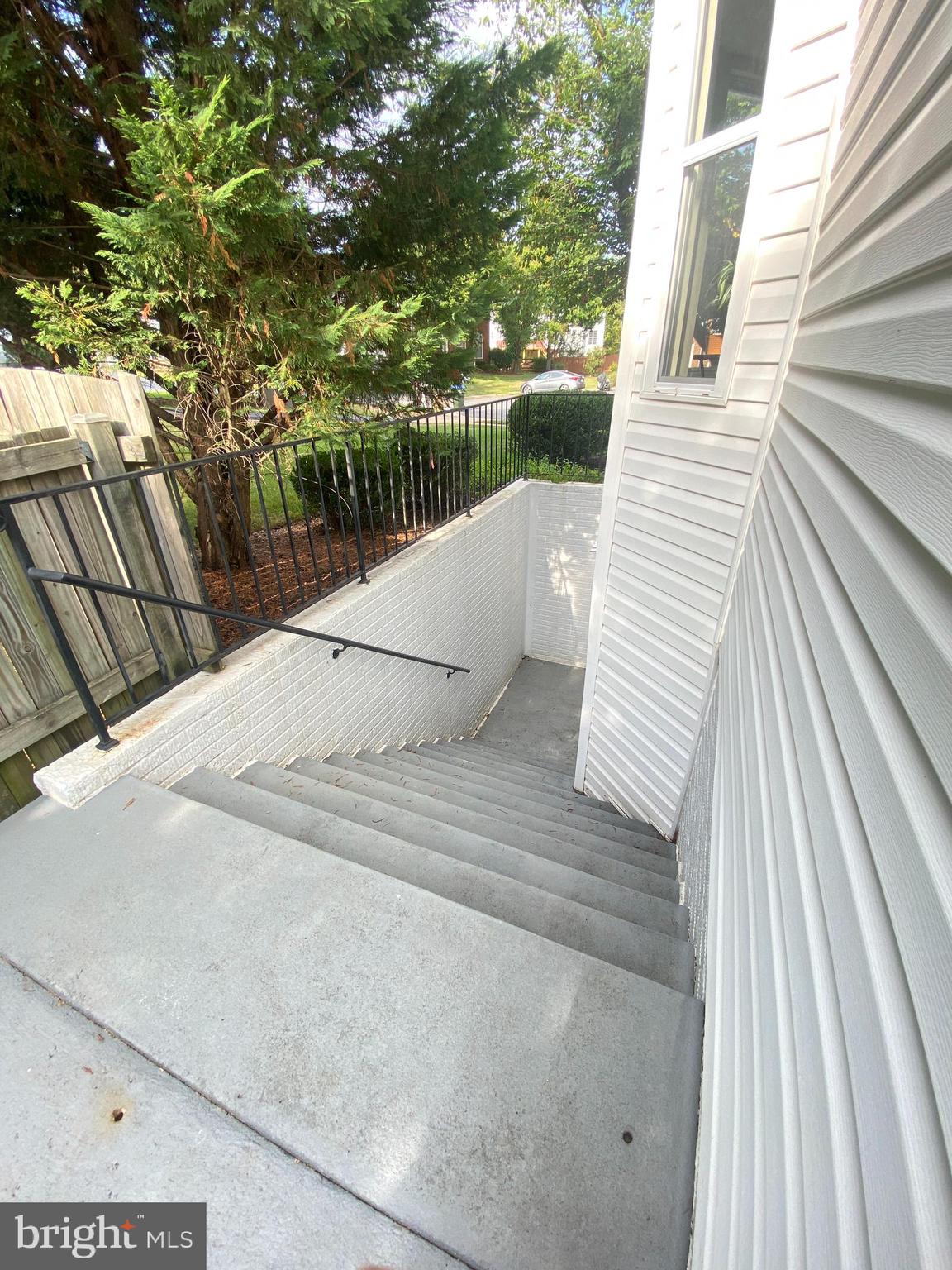 2408 Ripplemeade Court Herndon, VA 20171 - Photo 35 of 36 a view of balcony with wooden floor and fence