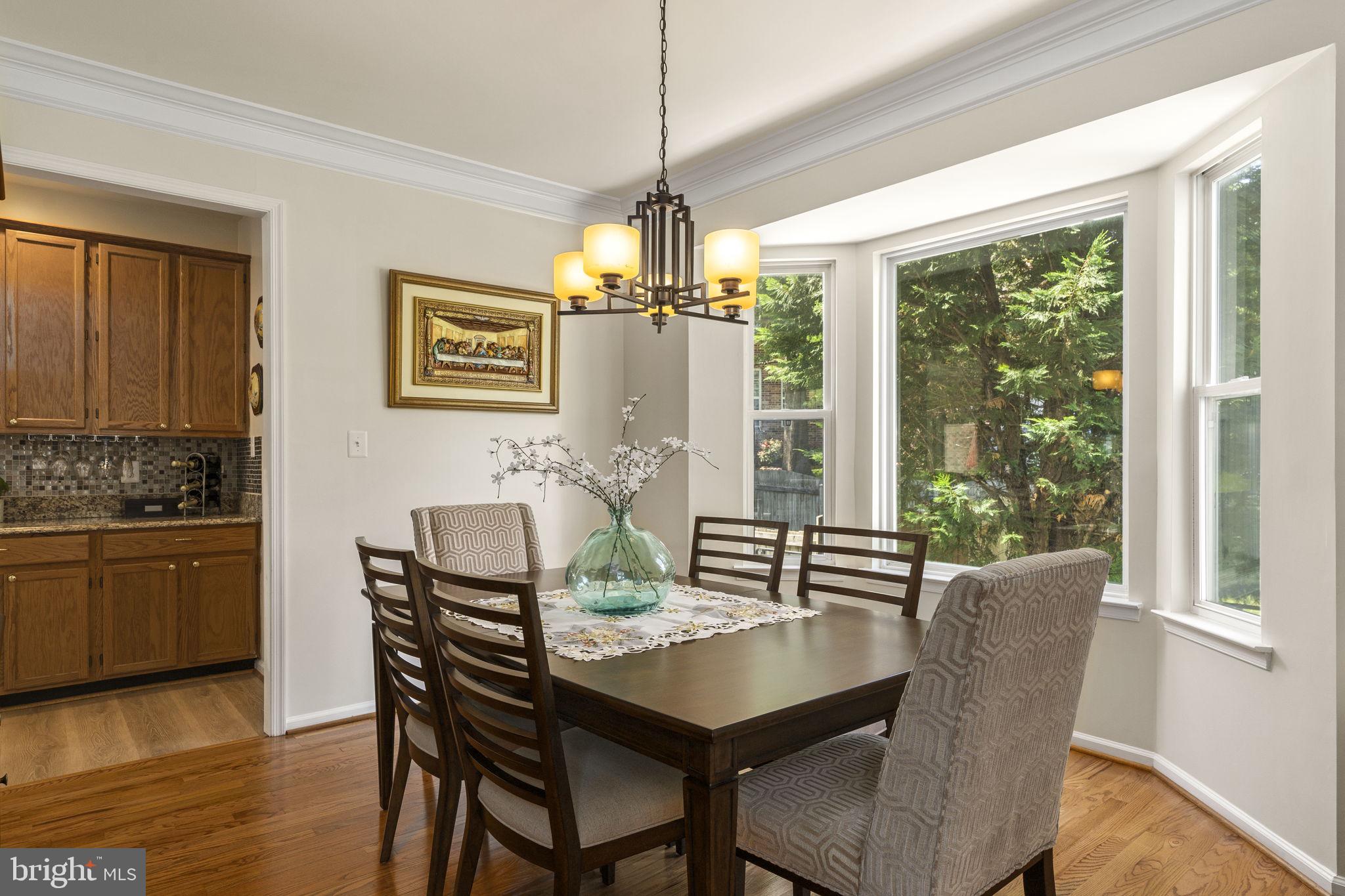 2408 Ripplemeade Court Herndon, VA 20171 - Photo 5 of 36 a view of a dining room with furniture window and wooden floor