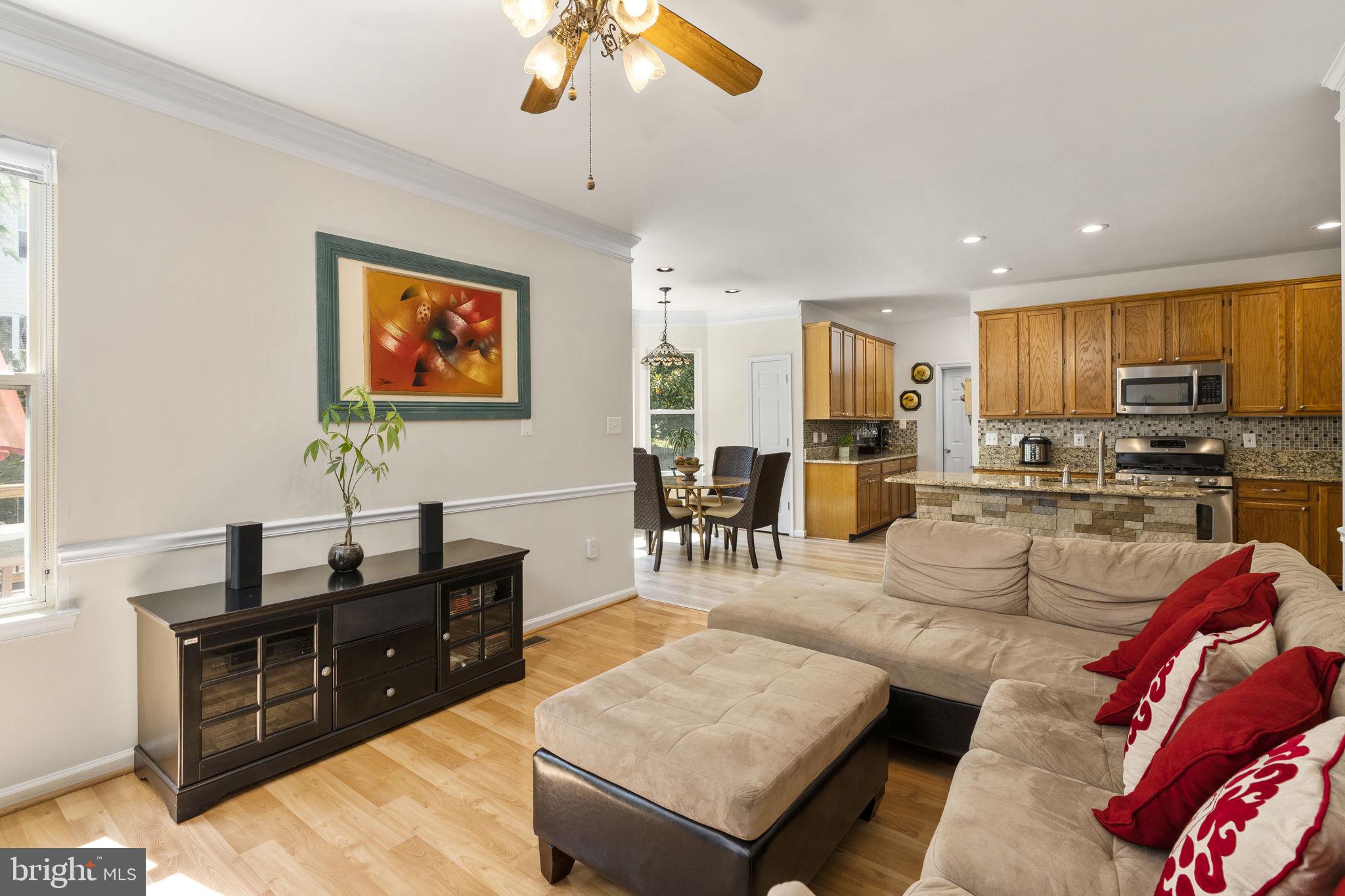 2408 Ripplemeade Court Herndon, VA 20171 - Photo 9 of 36 a living room with furniture kitchen view and a wooden floor