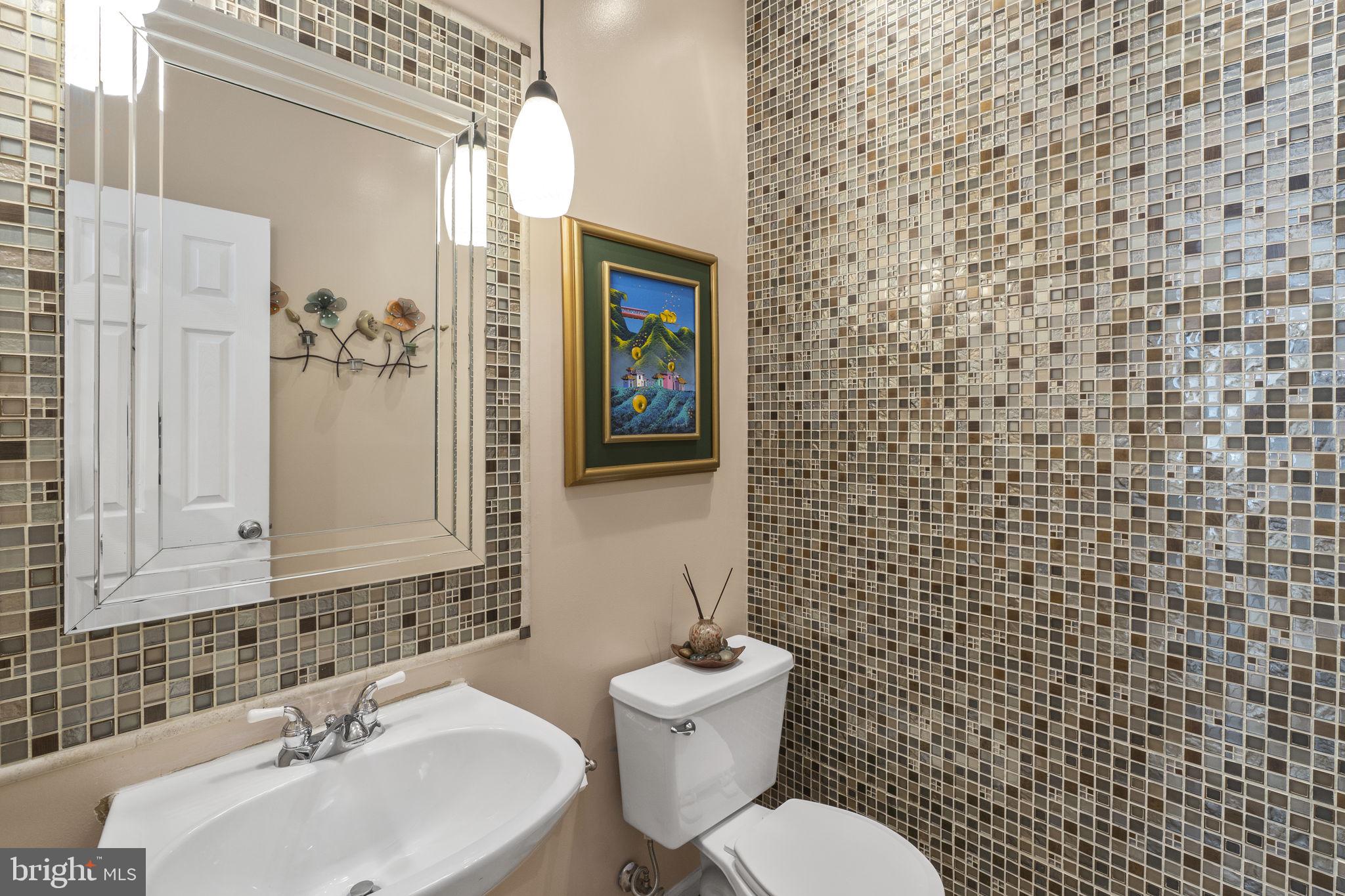 2408 Ripplemeade Court Herndon, VA 20171 - Photo 10 of 36 a bathroom with a sink a toilet and shower curtain
