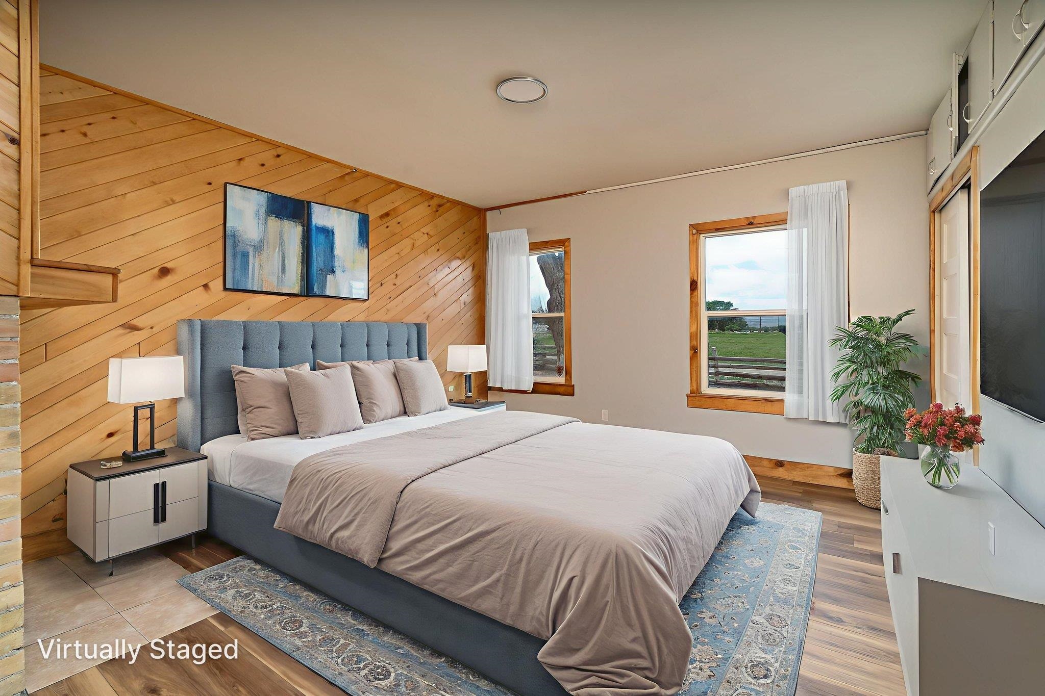 6038 Townsend Road Delta, CO 81416 - Photo 14 of 42 a bedroom with a large bed and a potted plant