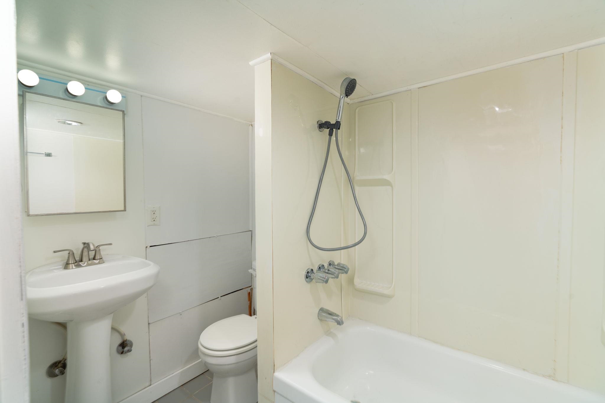 6038 Townsend Road Delta, CO 81416 - Photo 28 of 42 a bathroom with a sink toilet and shower