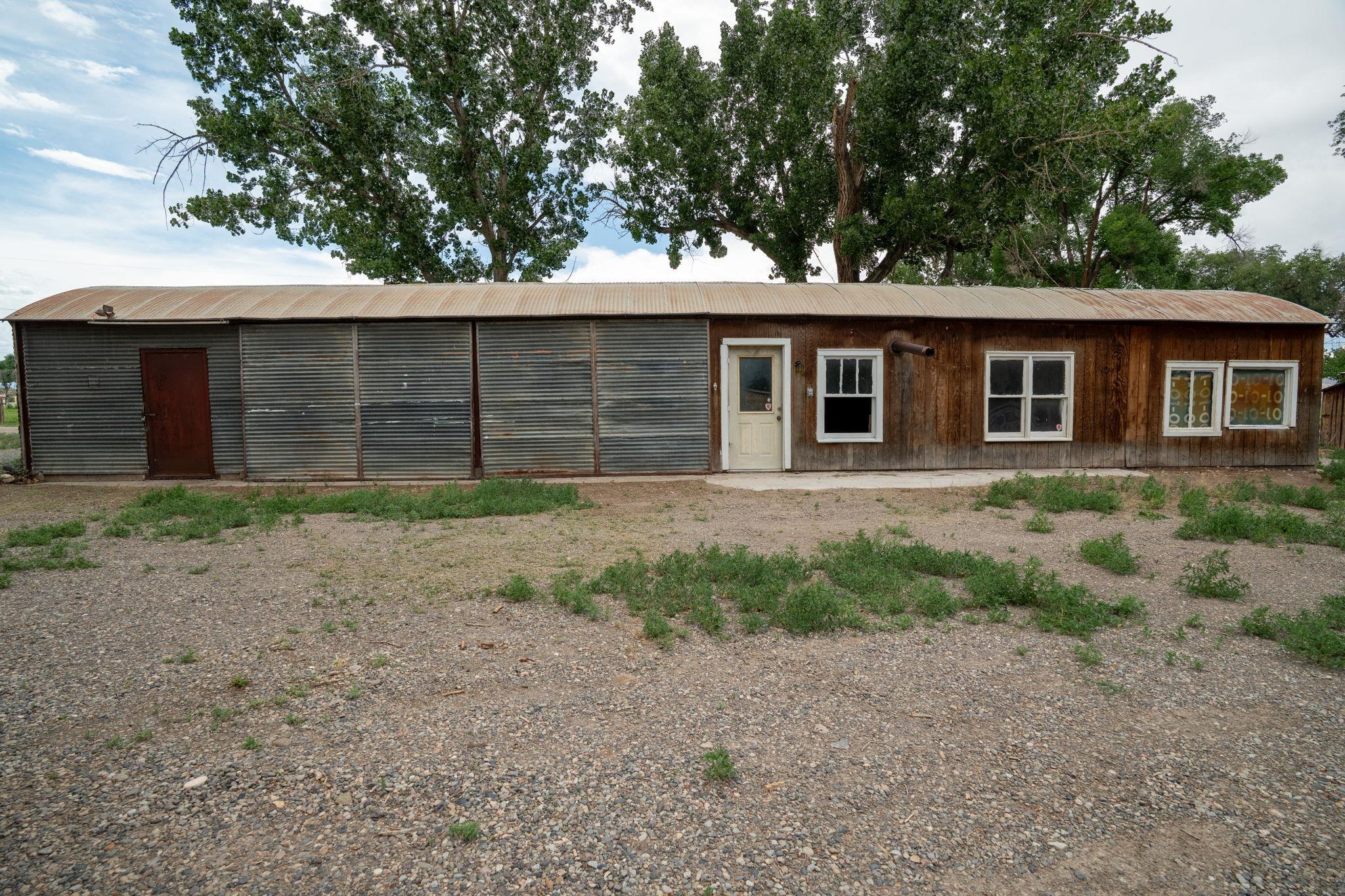 6038 Townsend Road Delta, CO 81416 - Photo 35 of 42 a front view of a house with a yard and garage
