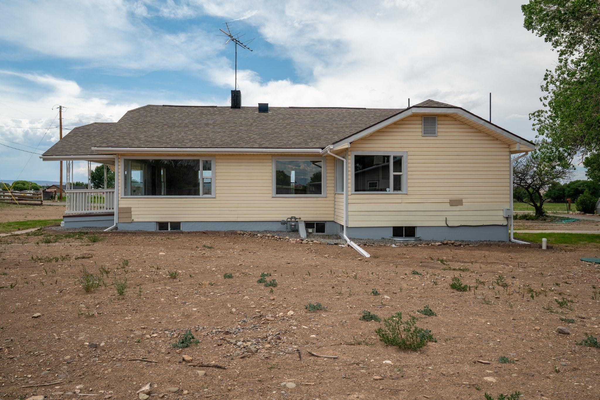 6038 Townsend Road Delta, CO 81416 - Photo 40 of 42 a view of a house with a yard