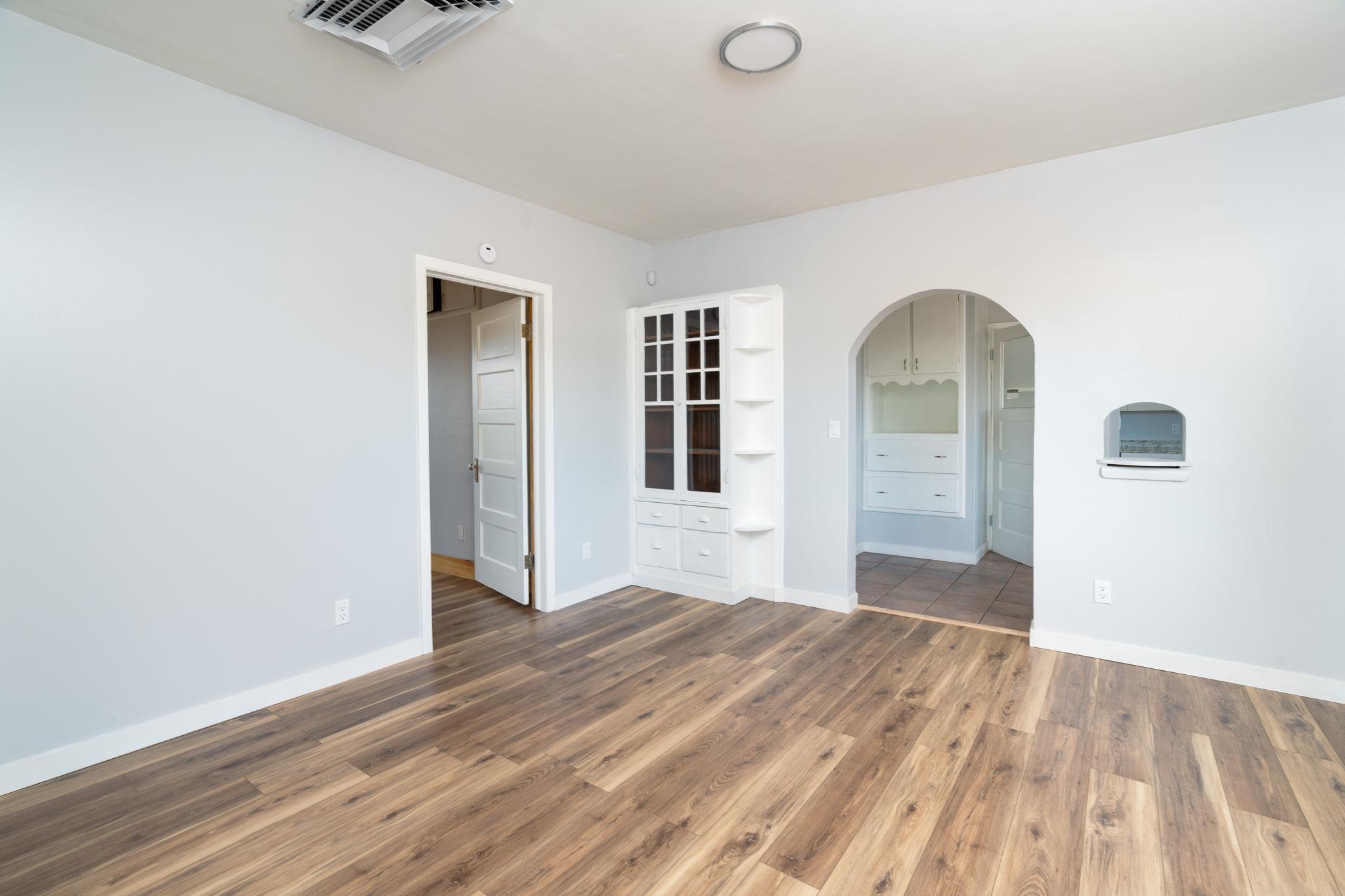 6038 Townsend Road Delta, CO 81416 - Photo 10 of 42 a view of empty room with wooden floor and fan