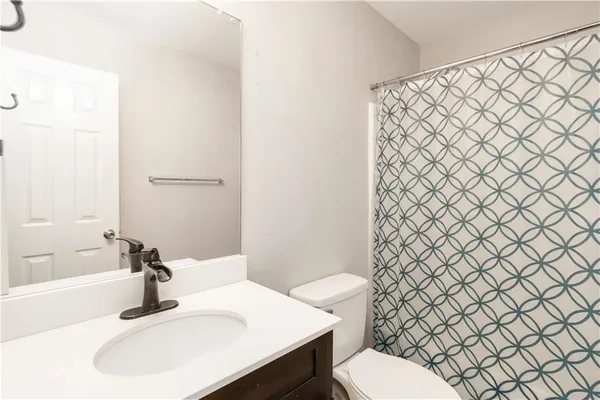 a bathroom with a sink and a toilet