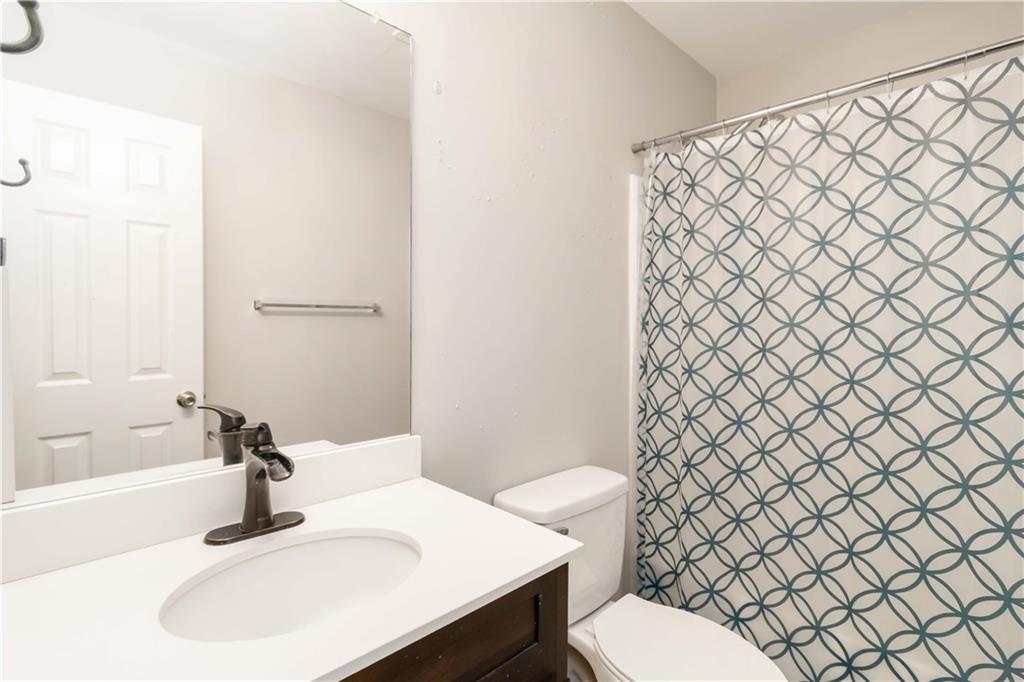 101 River View Court Hampton, GA 30228 - Photo 20 of 29 a bathroom with a sink and a toilet