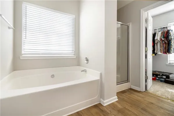 a white bath tub sitting next to a window