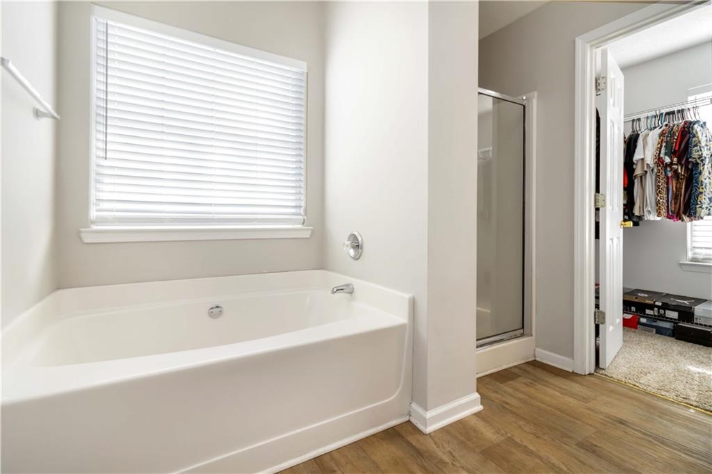 101 River View Court Hampton, GA 30228 - Photo 22 of 29 a white bath tub sitting next to a window