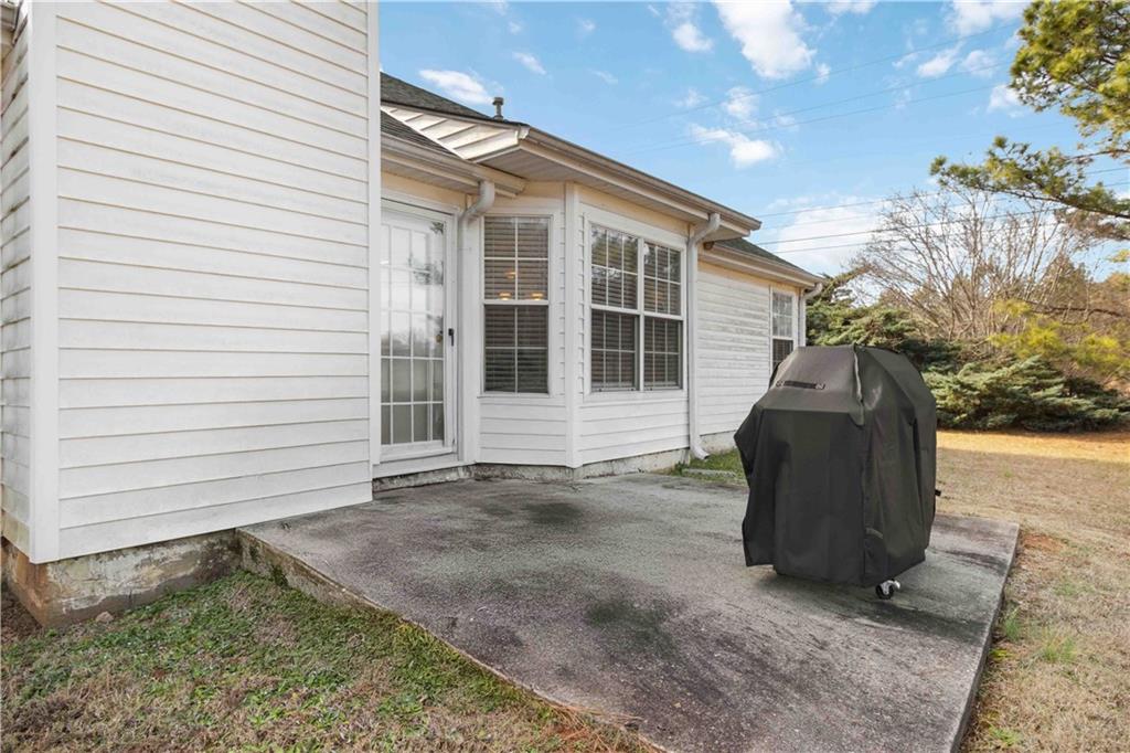 101 River View Court Hampton, GA 30228 - Photo 23 of 29 a front view of a house with a garden