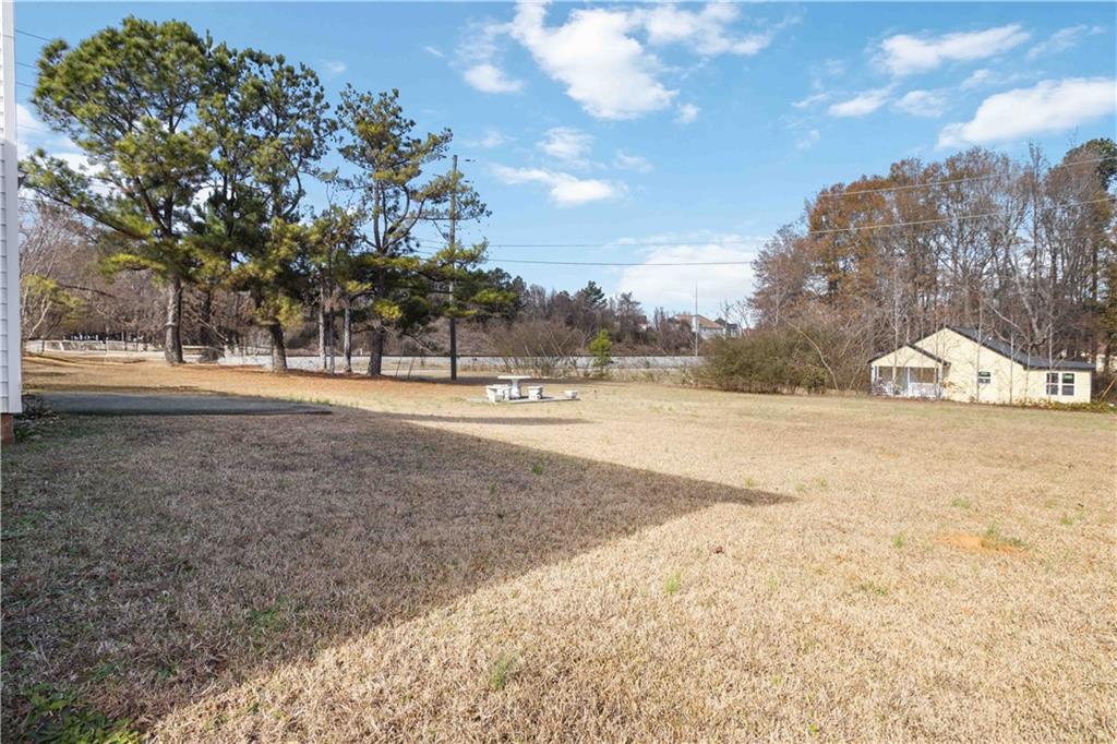 101 River View Court Hampton, GA 30228 - Photo 29 of 29 a view of dirt yard with a large tree