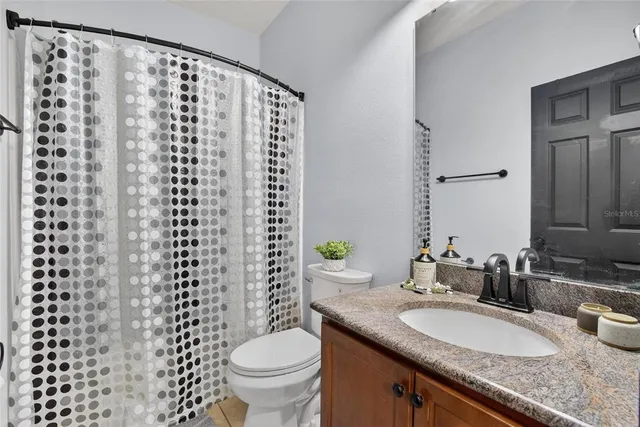 a view of a room that has a mirror in it