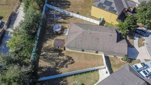 an aerial view of a house with garden space ocean view