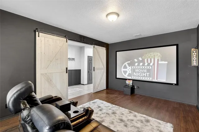 a large white kitchen with a large counter top space and appliances