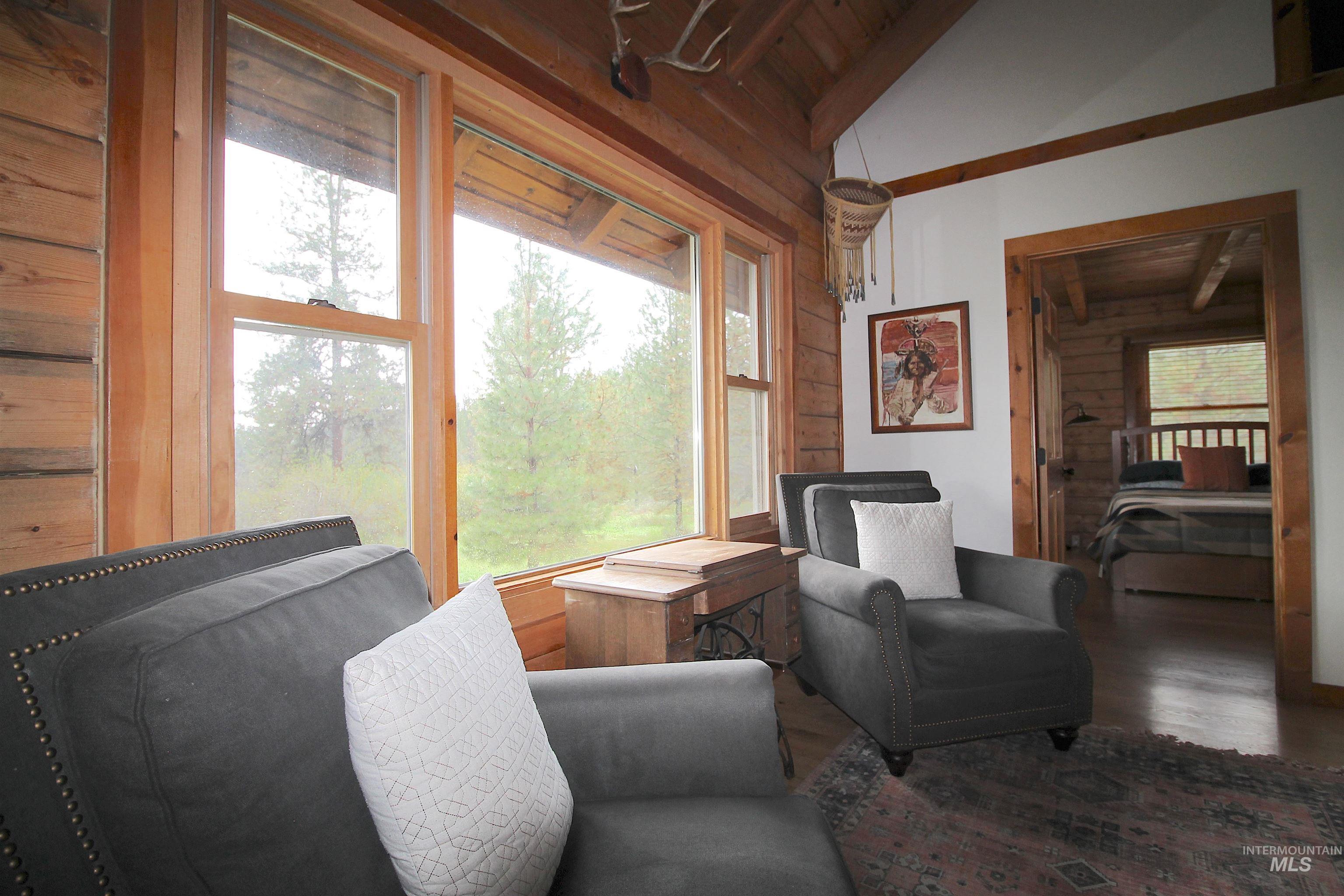 2609 Highway 95 Council, ID 83612 - Photo 22 of 49 Sitting room with wooden walls, a vaulted wood ceiling, and wood finished floors