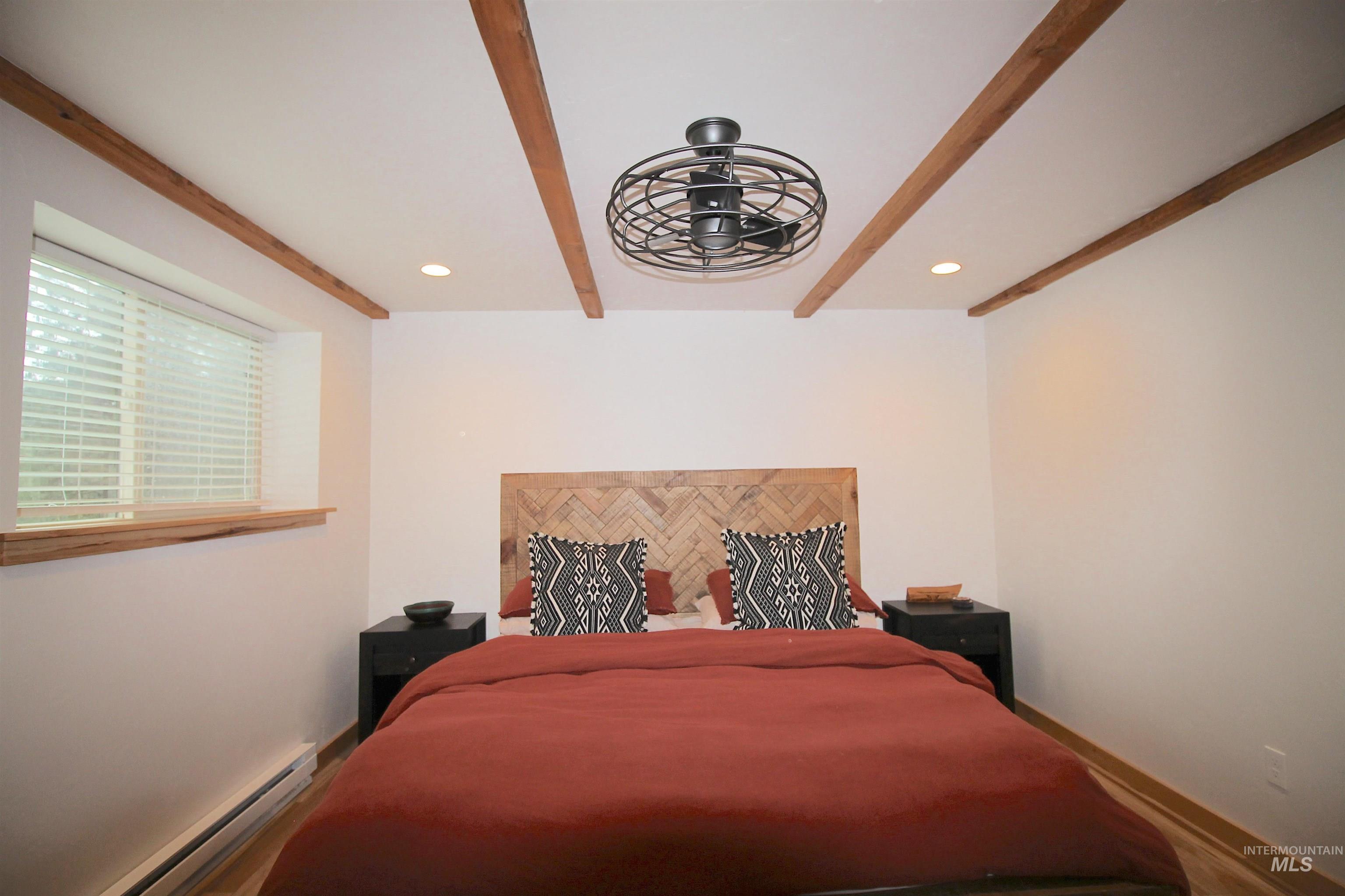 2609 Highway 95 Council, ID 83612 - Photo 37 of 49 Bedroom featuring a baseboard radiator, beam ceiling, and recessed lighting