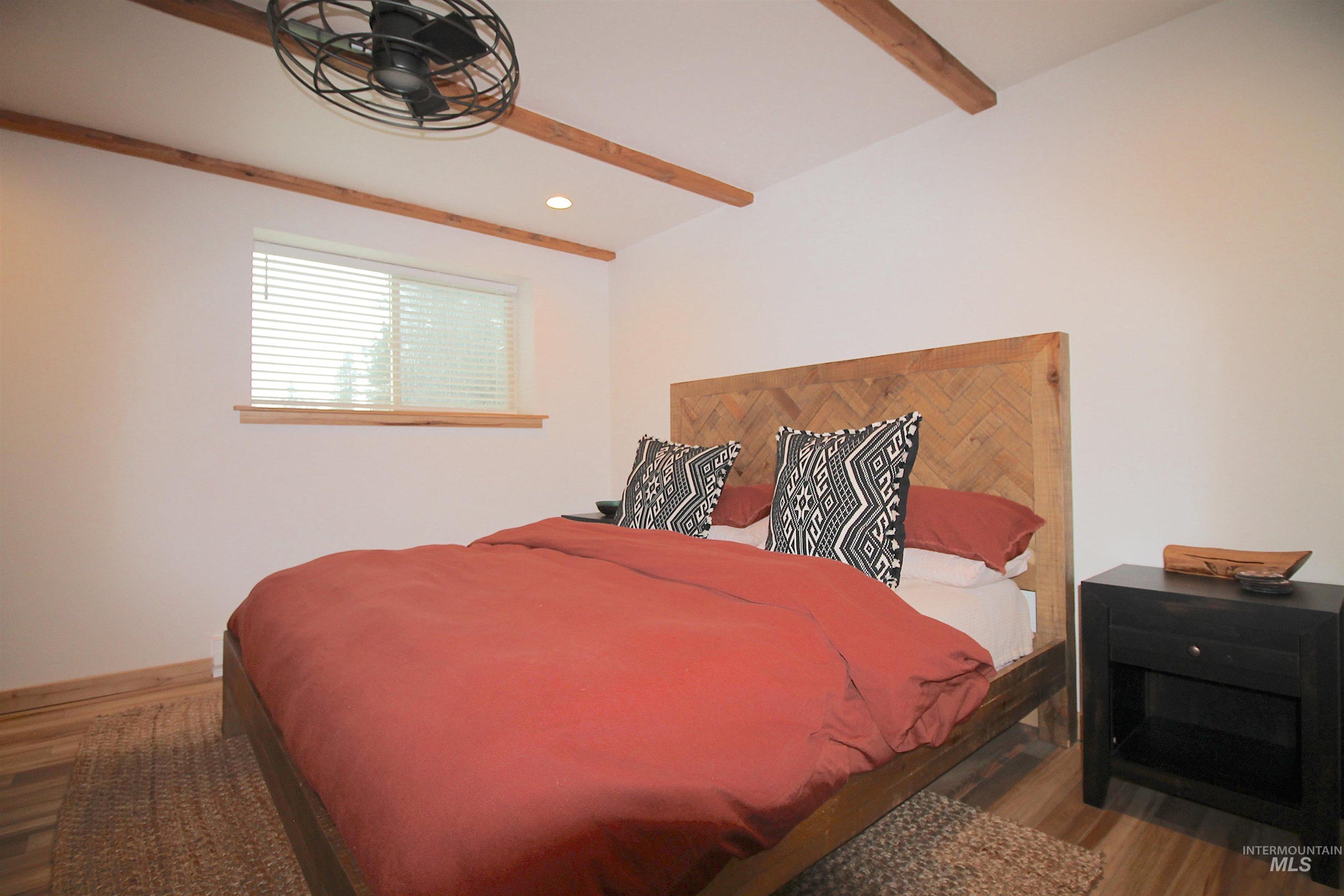 2609 Highway 95 Council, ID 83612 - Photo 38 of 49 Bedroom with wood finished floors, beam ceiling, and recessed lighting