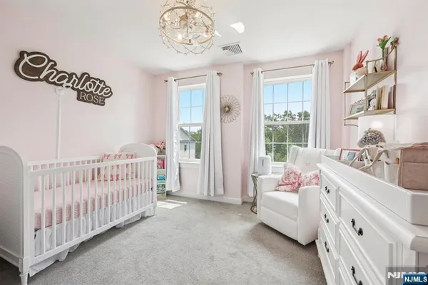 a bedroom with furniture and windows