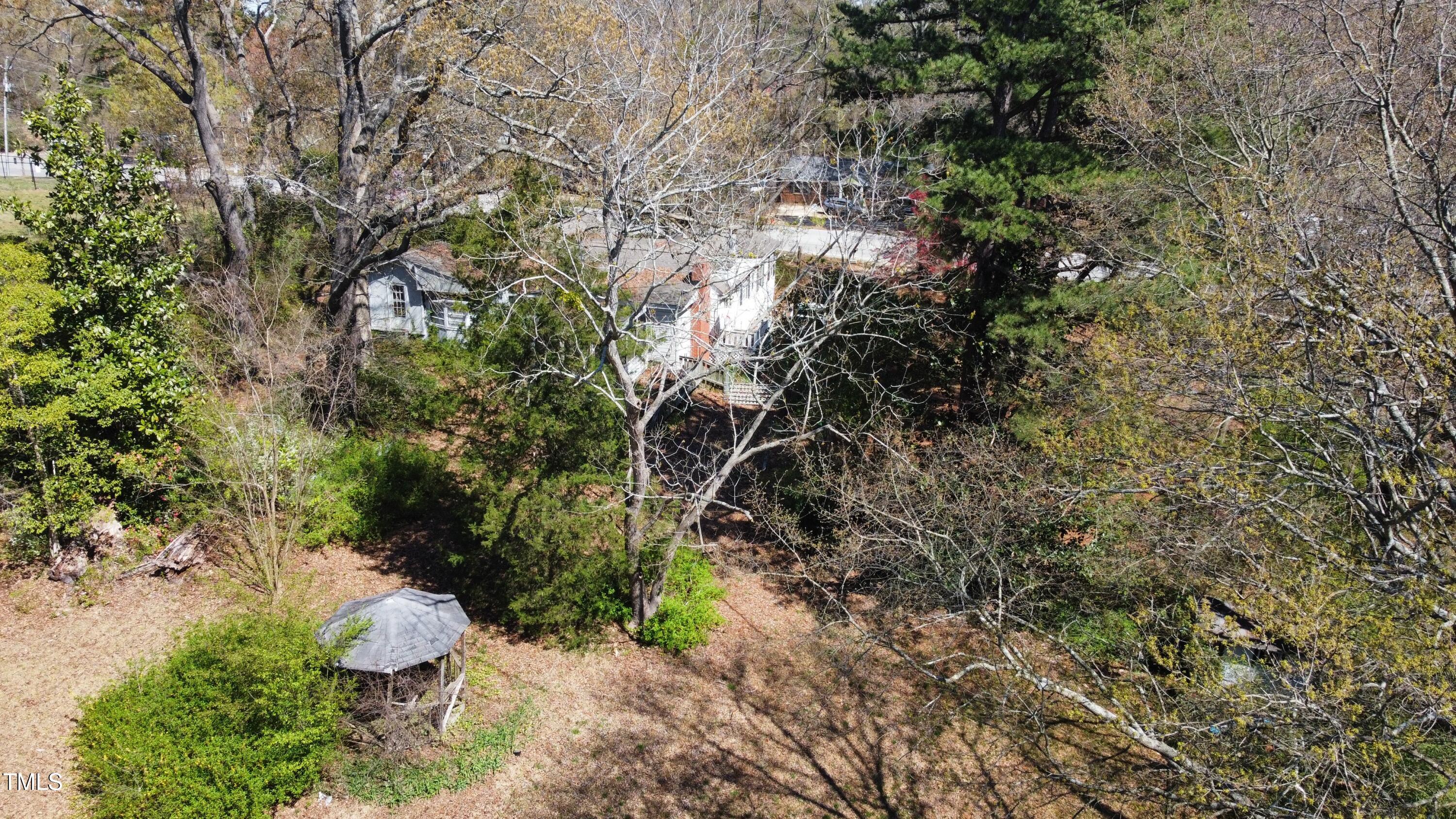 620 Sunnybrook Road Raleigh, NC 27610 - Photo 3 of 10 a backyard of a house with a yard and outdoor seating