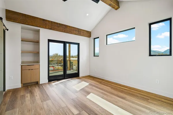 a view of an empty room with a window