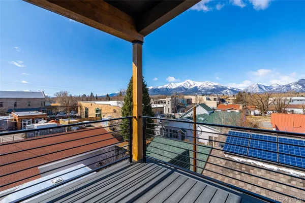 a view of a balcony with wooden floor
