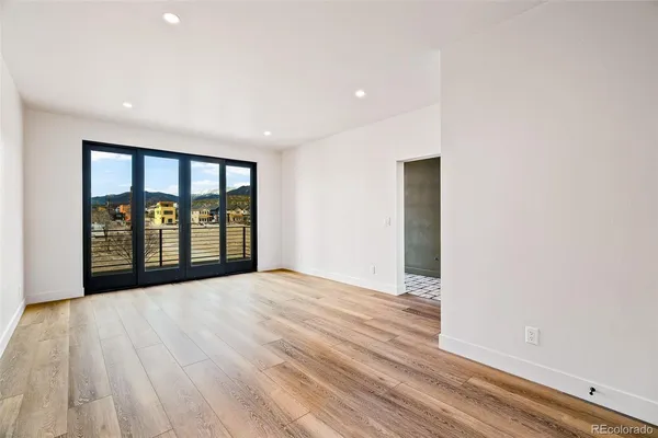 a kitchen with stainless steel appliances granite countertop a sink a stove and a refrigerator