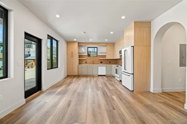 a bathroom with a white bath tub and a shower