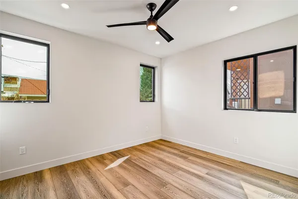 a bathroom with a sink toilet a mirror and shower
