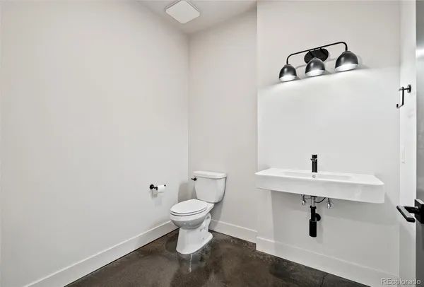 a bathroom with a sink and mirror