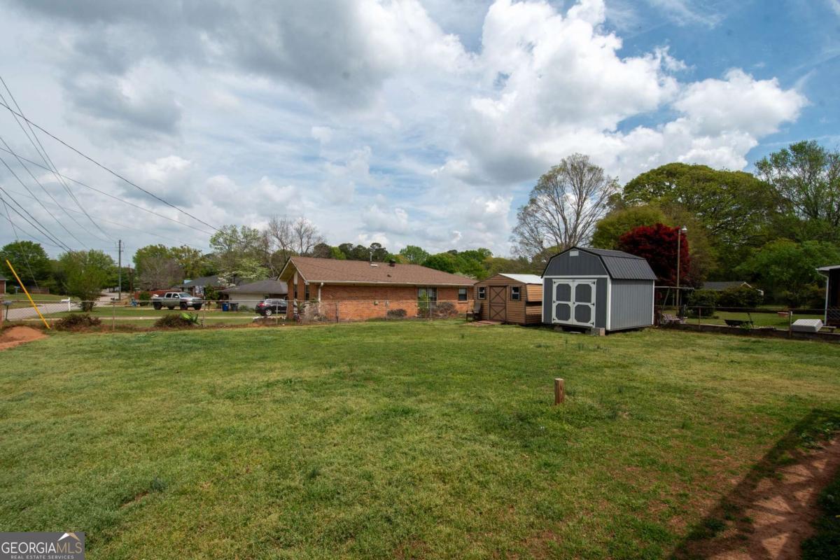 313 Mobley Street Griffin, GA 30223 - Photo 22 of 22 a front view of a house with garden