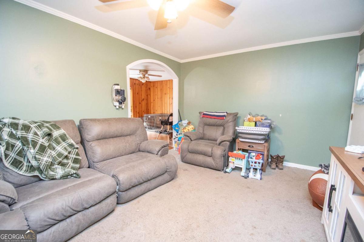 313 Mobley Street Griffin, GA 30223 - Photo 7 of 22 a living room with furniture and a window