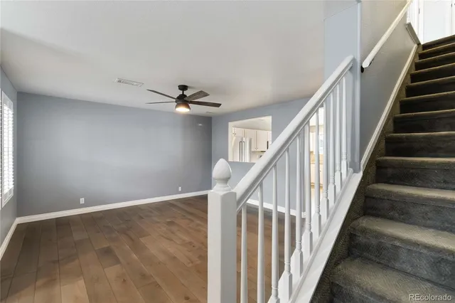 a view of an empty room with stairs