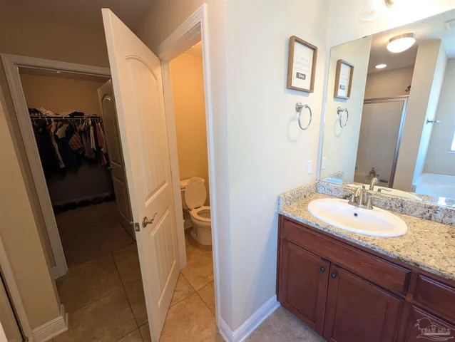 a en suite bathroom with a sink and mirror