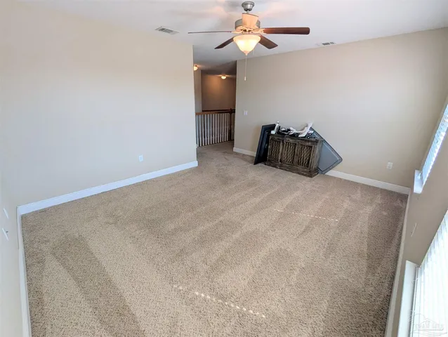 a view of a room with a hanging light