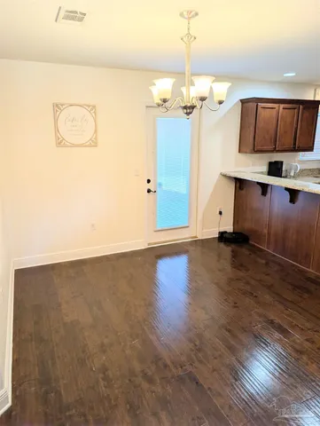 a view of a livingroom with wooden floor