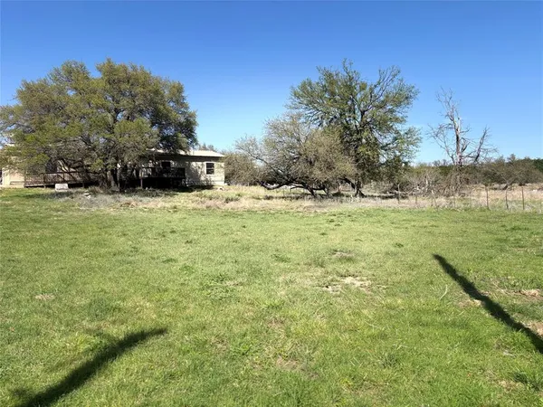 a fire hydrant in the middle of a field