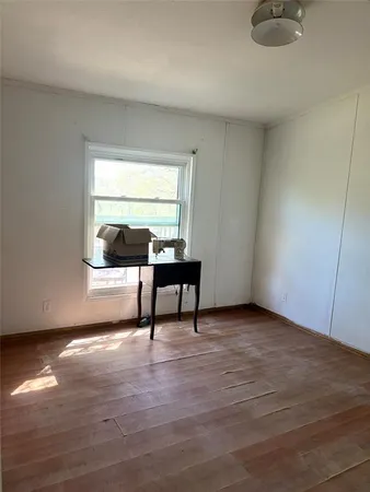 a view of a room with furniture window and wooden floor