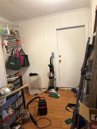 a room with gym equipment and a flat screen tv