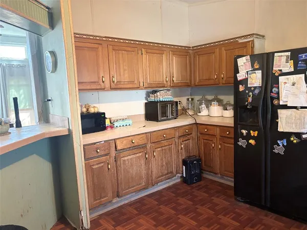 a kitchen with a sink stove and refrigerator